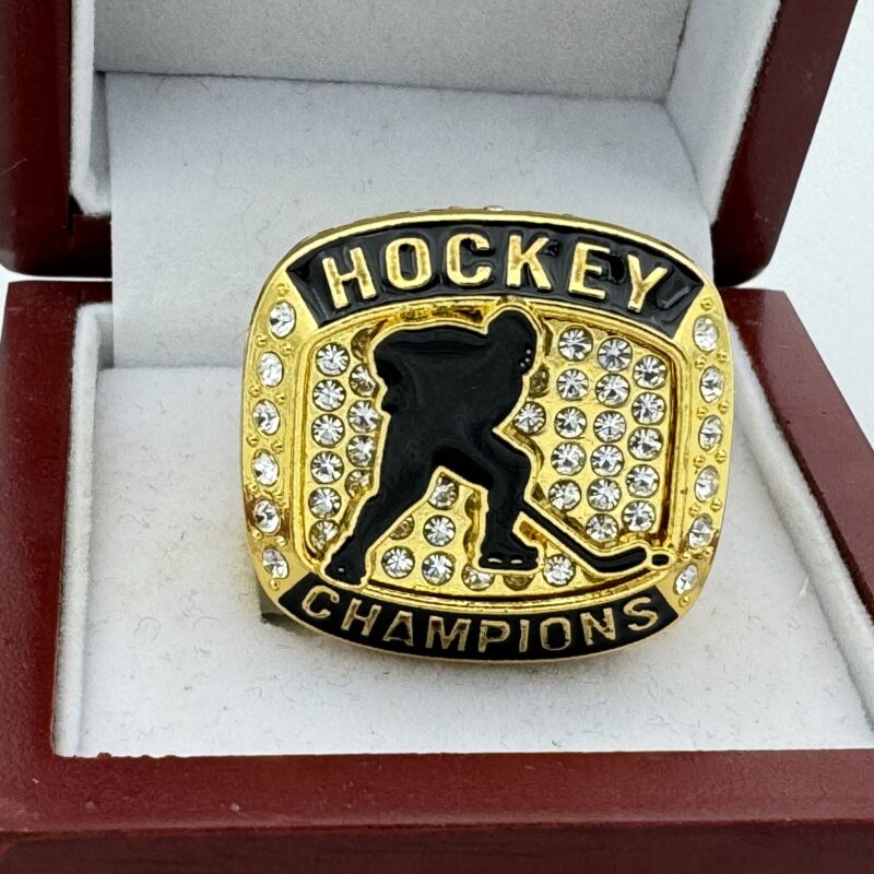 black and gold hockey champion ring