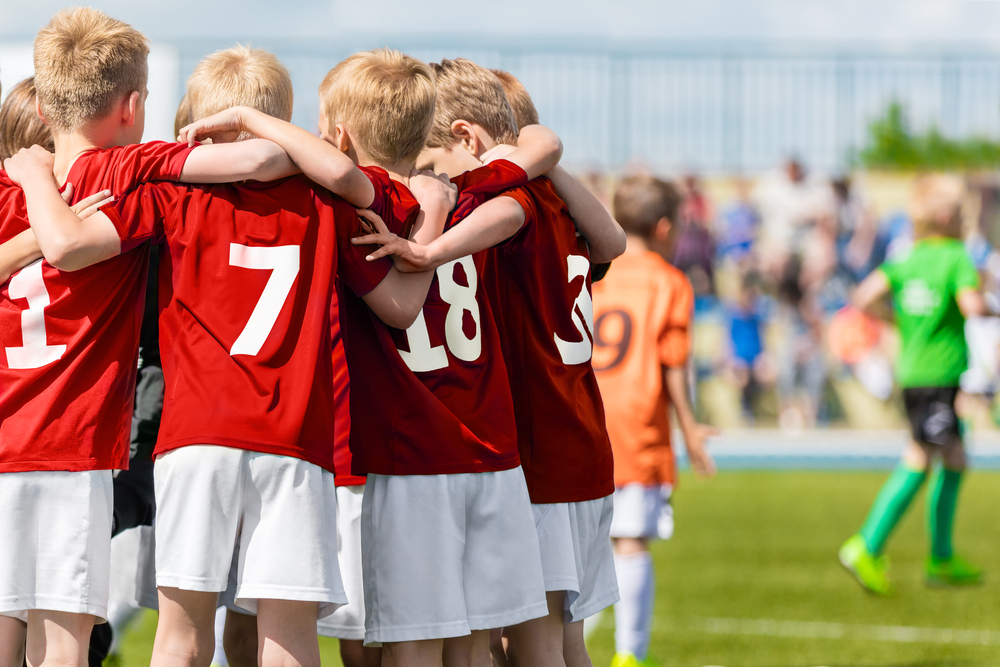 Kids Soccer Players in Red Shirts Standing Together