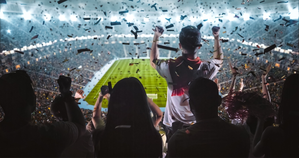 Group of fans are cheering for their team victory