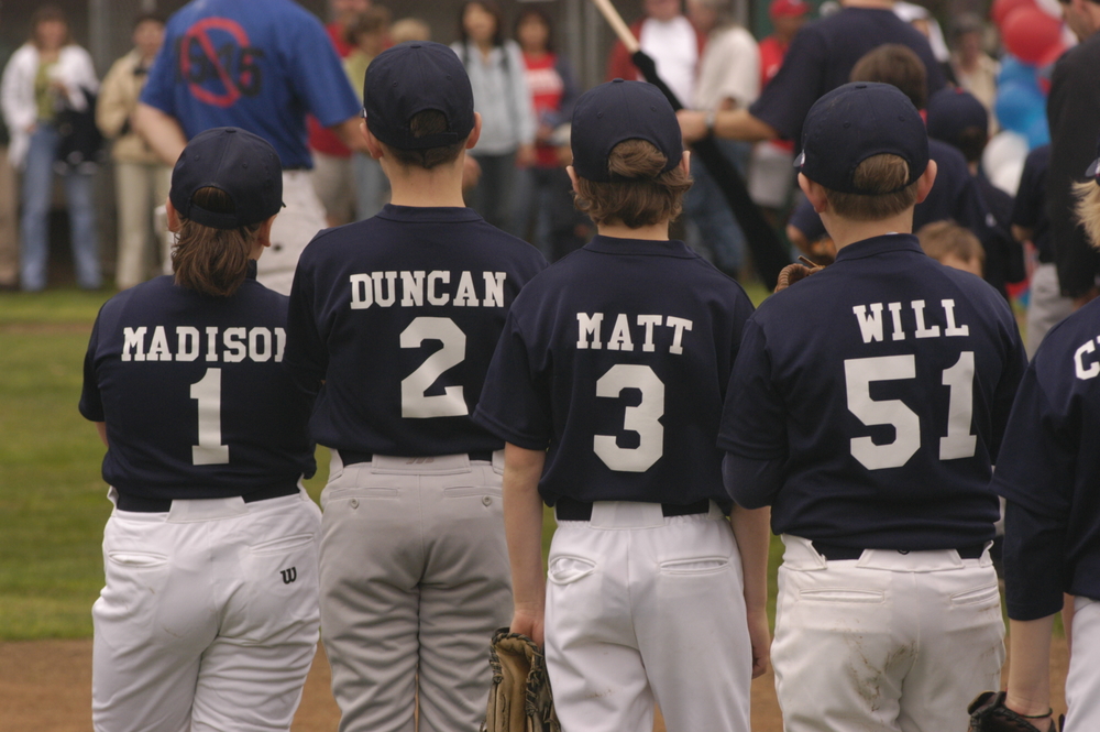 Four baseball kids facing away