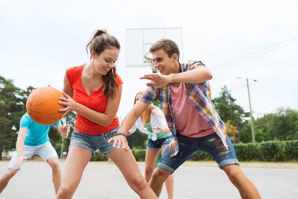 How to Display Your Championship Rings Like a True Champion - group of happy teenagers playing basketball outdoors