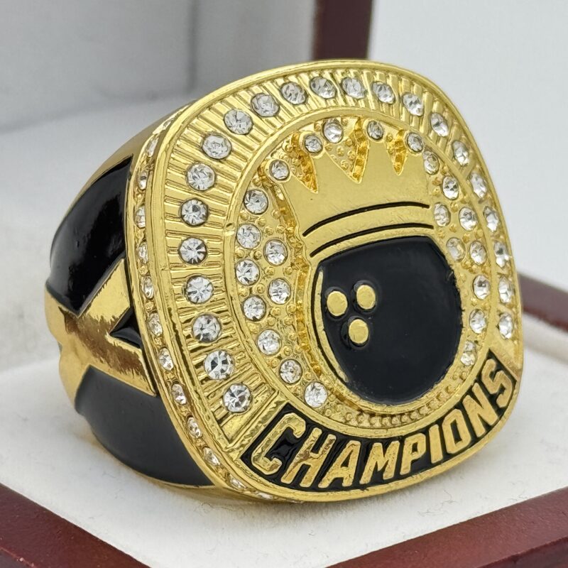 gold and black bowling champions ring