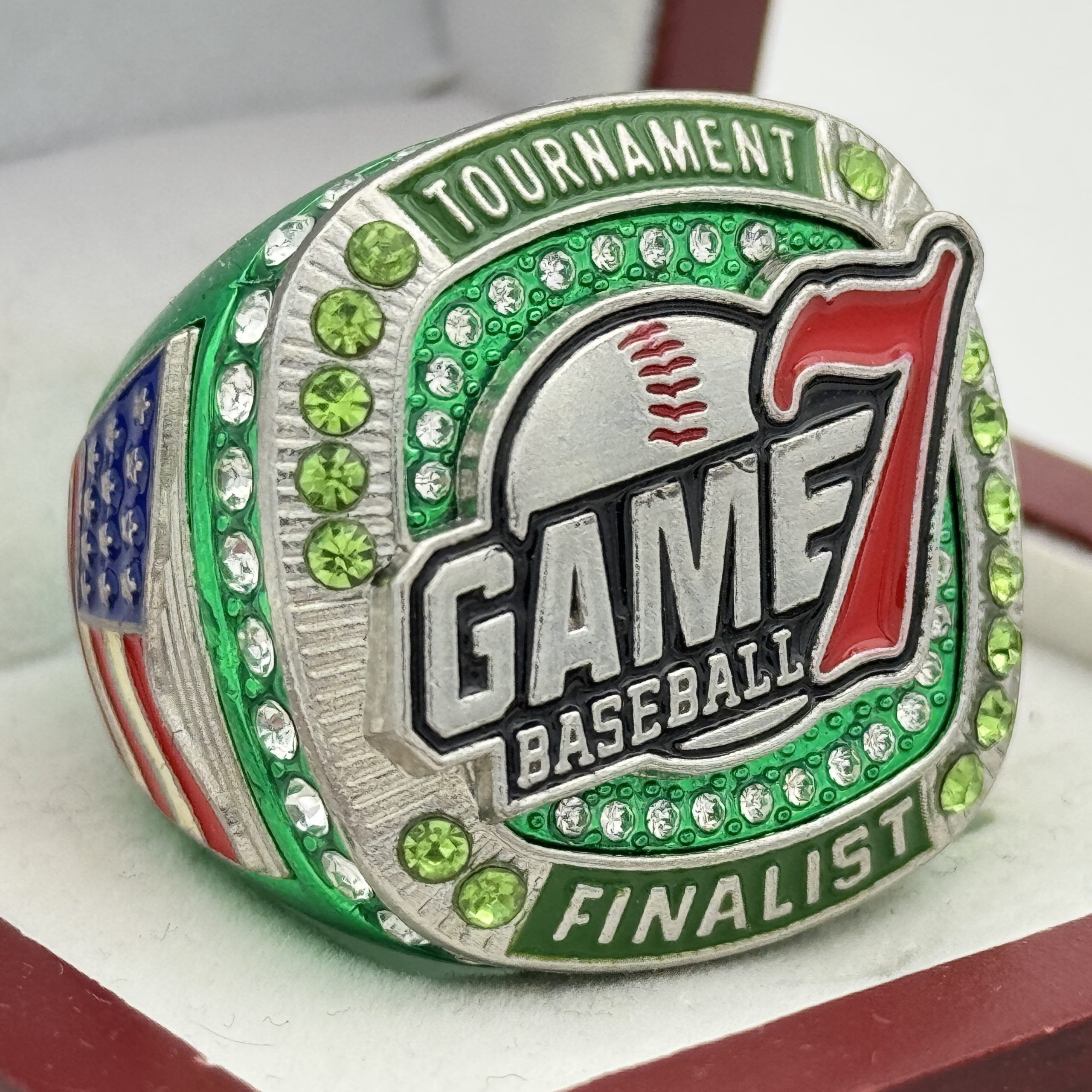 green game 7 finalist ring with gems and flashy design