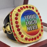 ROUND ADD YOUR LOGO RING --- GOLD BODY, RED STONES (Item #58-212)