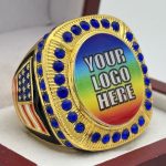 ROUND ADD YOUR LOGO RING --- GOLD BODY, BLUE STONES (Item #58-220)