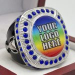 ROUND ADD YOUR LOGO RING --- SILVER BODY, BLUE STONES (Item #58-217)