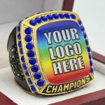 SQUARE ADD YOUR LOGO CHAMPION RING --- GOLD BODY, BLUE STONES, 2 ENGRAVABLE SIDES (Item #58-184)