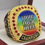 ROUND ADD YOUR LOGO CHAMPION RING --- GOLD BODY, RED STONES, 2 ENGRAVABLE SIDES (Item #58-164)